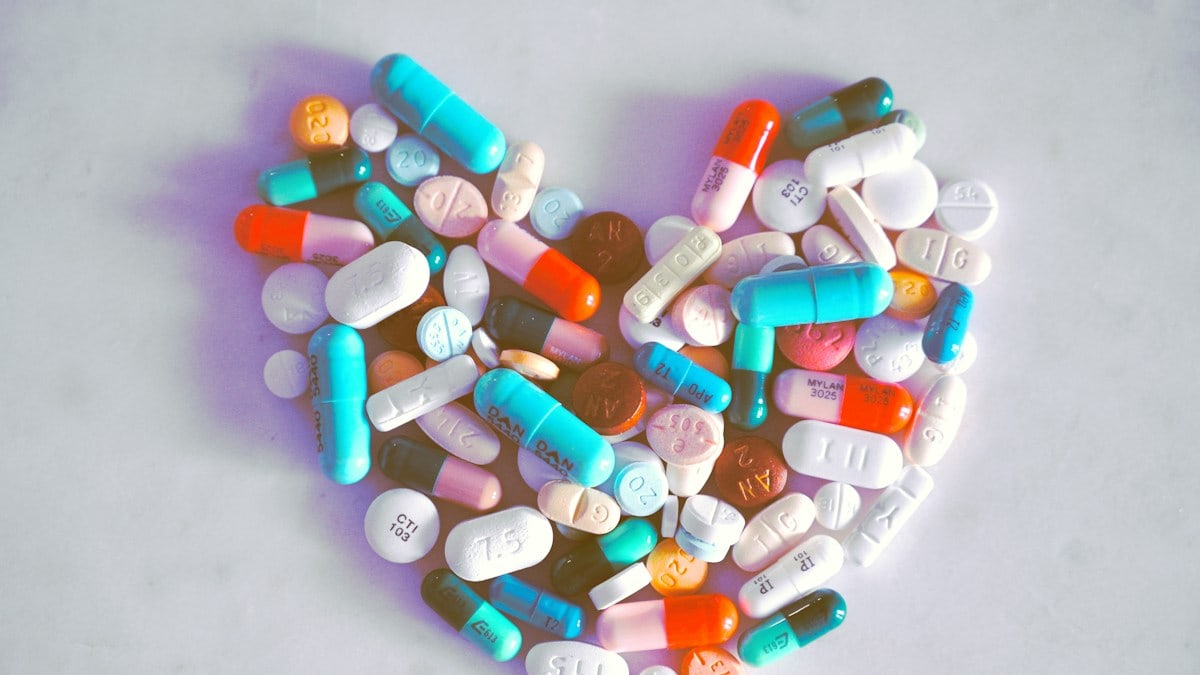 A compiled bunch of pills shaped into a heart, because art.