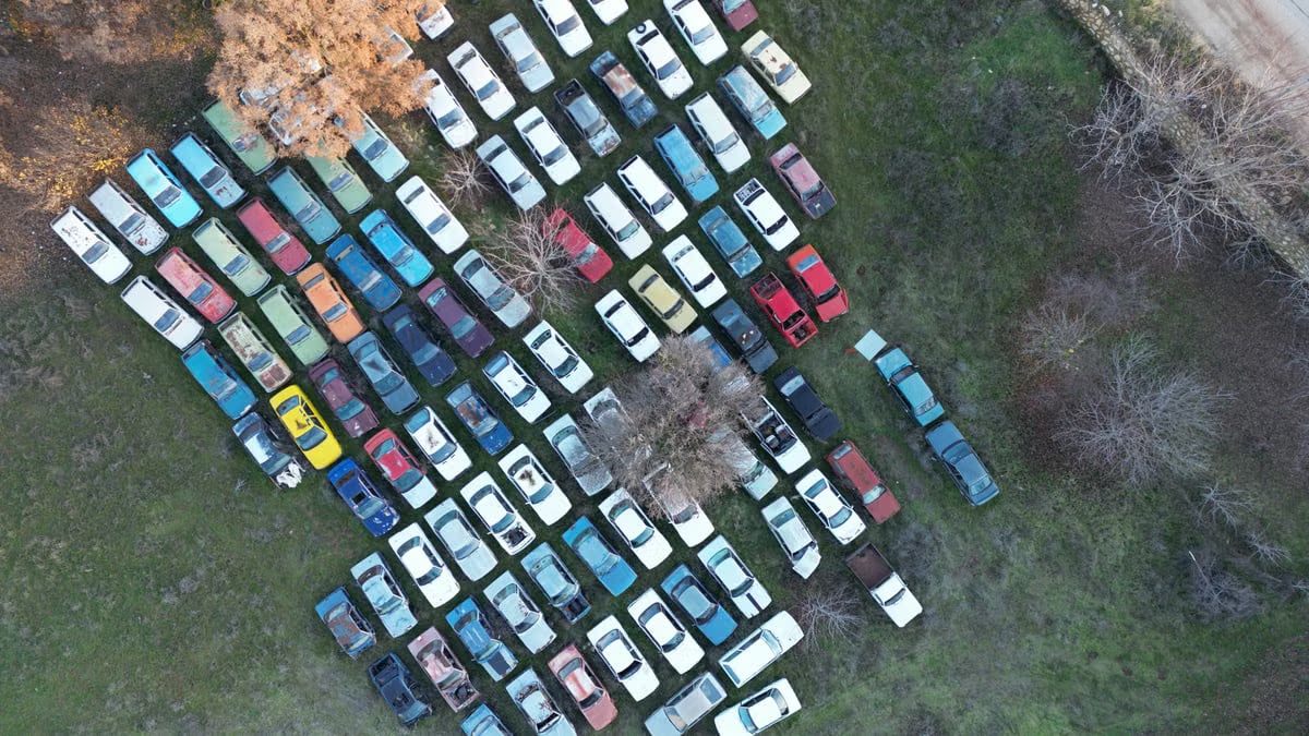 Aerial shot showcasing a collection of vintage cars in a junkyard in Denizli, Türkiye.
